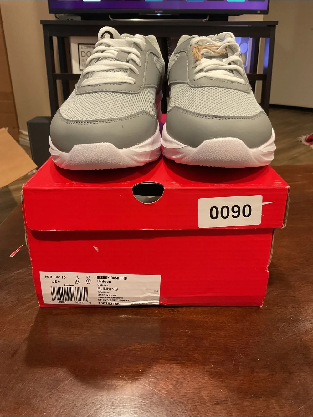 Men's grey running shoes on box size 9